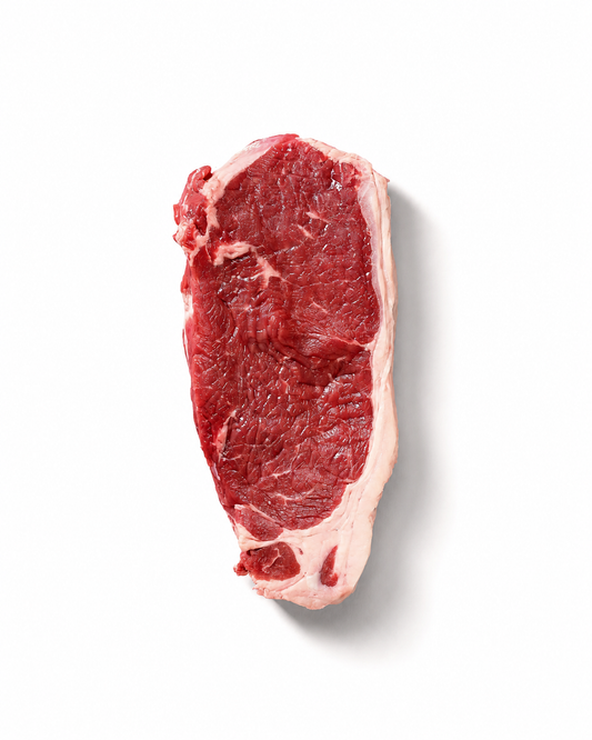 A single raw beef steak with visible marbling, photographed from above on a clean white background with a soft drop shadow.